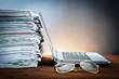 newspaper,glasses and laptop