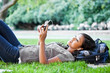 Asian college student listening to music