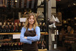 store owner in front of shop
