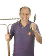 Foto: middle age senior man gardener with spade and bow rake tools middle age senior man gardener with spade and bow rake tools