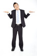 Young businessman shrugging