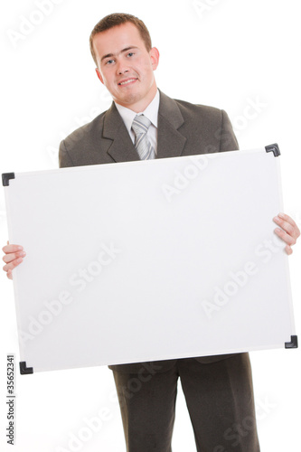 Photo: Man holding a white board. Man holding a white board.
