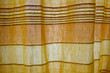 Sunlight through yellow and orange curtain