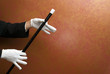 Magician performing with wand
