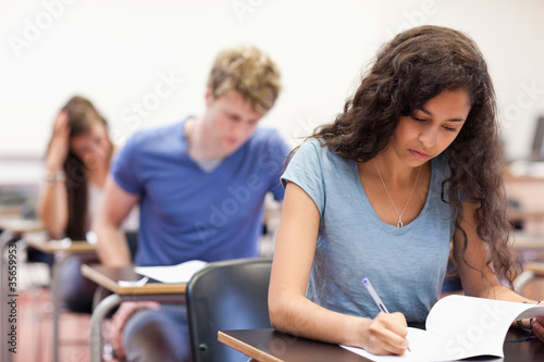 Photo: Young students working on an assignment Young students working on an assignment