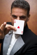 Magician performing with card