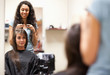 Woman combing the hair of a customer