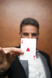 Magician performing with card