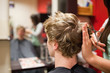 Blond-haired man having a haircut