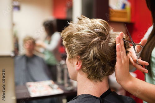 Photo: Blond-haired man having a haircut Blond-haired man having a haircut