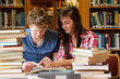 Serious students looking at a book