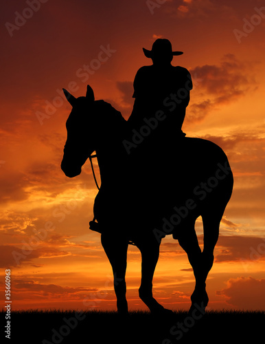 Photo: cowboy silhouette in sunrise cowboy silhouette in sunrise