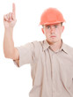 Businessman in helmet pointing up.