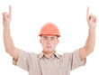 Businessman in helmet pointing up.