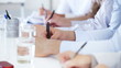 Cropped image of business woman noting schedule