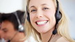 Closeup of beautiful call center representative on call