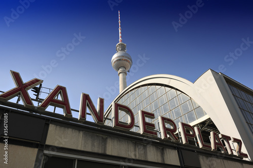 Photo: Alexanderplatz station sign and the TV Tower in Berlin Alexanderplatz station sign and the TV Tower in Berlin