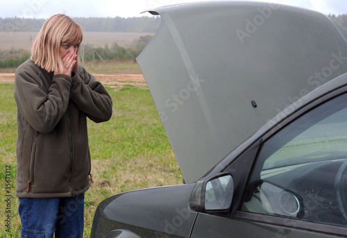 Photo: Woman and Her Broken Car Woman and Her Broken Car