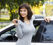 Pretty girl showing the car key