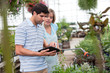 Woman pointing at digital tablet screen Woman pointing at digital tablet screen