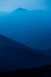 blue color of mountains during sunset blue color of mountains during sunset