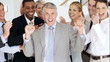 Excited mature business man with his successful team