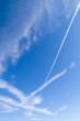 Deep blue sky with many crossing contrails in the Majorca sky