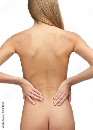 Photo: Woman with back pain Woman with back pain