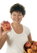 excited middle age senior woman with fresh peaches fruit