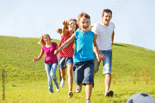 Photo: Happy family running Happy family running