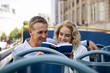 Photo: A middle-aged couple on a bus, looking at a guidebook A middle-aged couple on a bus, looking at a guidebook