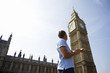 A man checking his watch next to Big Ben