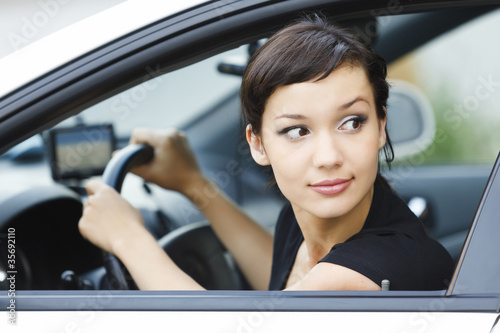 Photo: Girl parking a car Girl parking a car