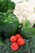 Grape or cherry tomatoes on green