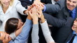 High angle view of victorious business people giving high five