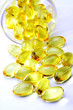 Photo: Cod liver oil pills on white Cod liver oil pills on white