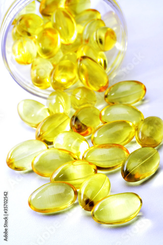 Photo: Cod liver oil pills on white Cod liver oil pills on white