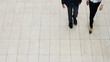 Male and female executives taking stroll together