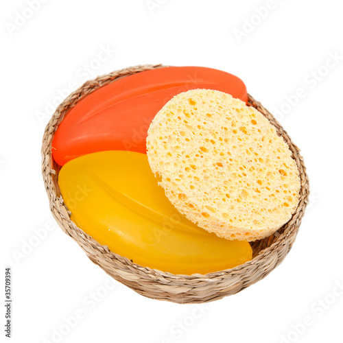 Photo: colorful soap and sponge in a woven basket colorful soap and sponge in a woven basket