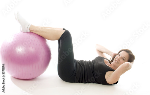 Photo: woman exercising core training fitness ball woman exercising core training fitness ball