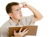 The man in glasses with a book.