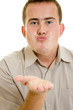 A man sends a air kiss.