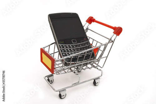 Photo: mobile phone in shopping cart mobile phone in shopping cart
