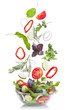 Фото: Falling vegetables for salad isolated on white Falling vegetables for salad isolated on white