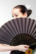 closeup portrait of flamenco dancer with fan