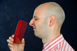Foto: funny man without hair and comb funny man without hair and comb