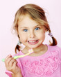 Young girl brushing her teeth