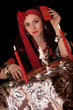 Photo: Gypsy woman sitting with cards. Isolated Gypsy woman sitting with cards. Isolated