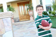 Photo: Young Boy at home with Football Young Boy at home with Football