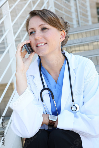 Photo: Beautiful Woman Nurse on phone Beautiful Woman Nurse on phone